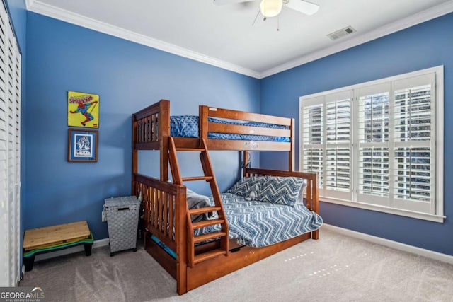 bedroom featuring visible vents, crown molding, baseboards, and carpet floors