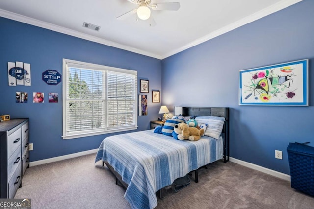 carpeted bedroom with visible vents, baseboards, and crown molding