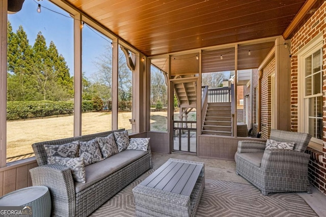 view of patio / terrace with an outdoor living space and stairway