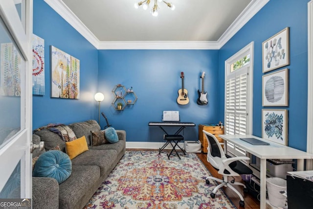 office area featuring wood finished floors, baseboards, and ornamental molding