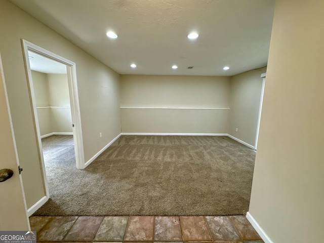 below grade area featuring recessed lighting, baseboards, and carpet floors