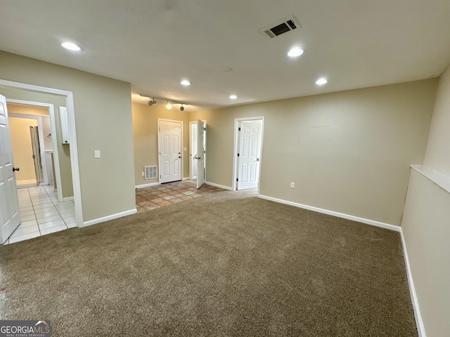 unfurnished room with recessed lighting, visible vents, and light colored carpet