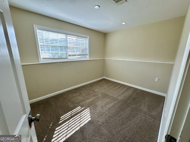 unfurnished room with carpet flooring, recessed lighting, a textured ceiling, and baseboards