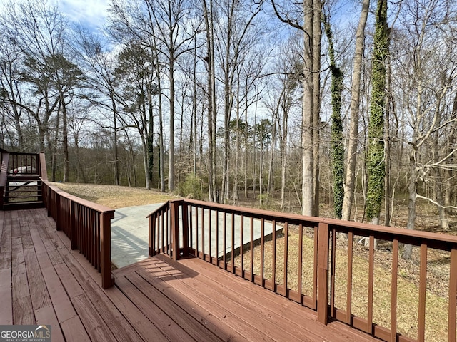 wooden terrace with a view of trees