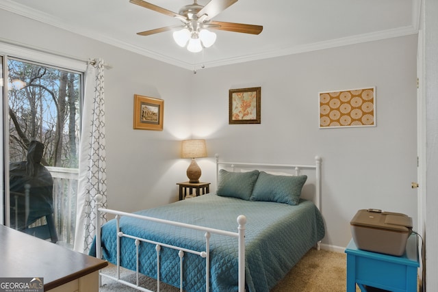 bedroom featuring ceiling fan, baseboards, carpet floors, and ornamental molding