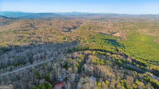 bird's eye view with a mountain view and a view of trees