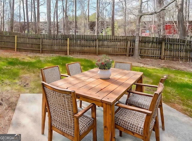 view of patio / terrace featuring outdoor dining space and fence