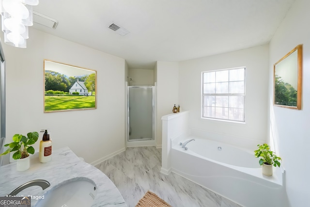 bathroom with visible vents, marble finish floor, a stall shower, a sink, and a bath