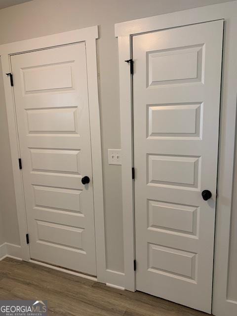 details featuring baseboards and wood finished floors