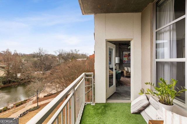 balcony featuring a water view