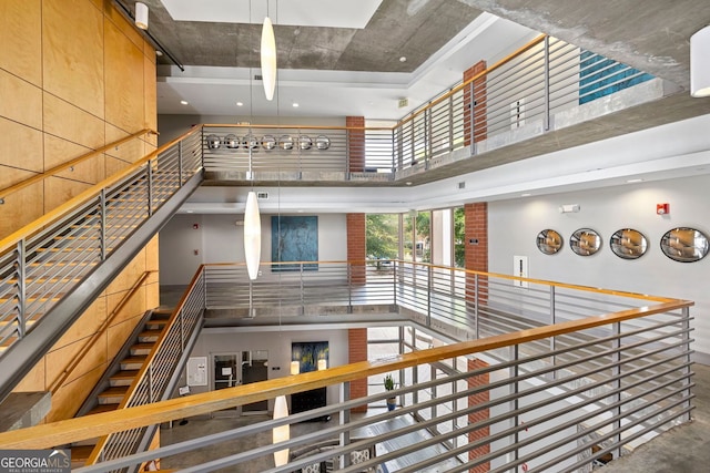 stairs featuring a high ceiling