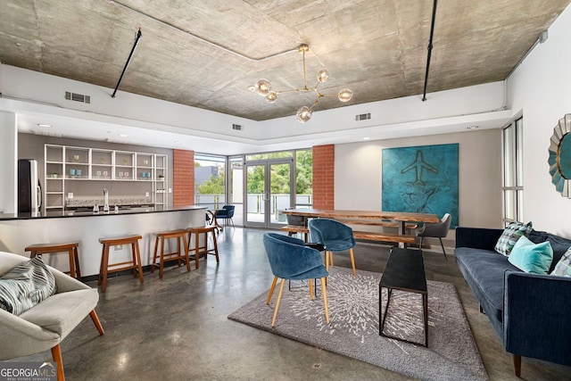 living area with visible vents and concrete floors