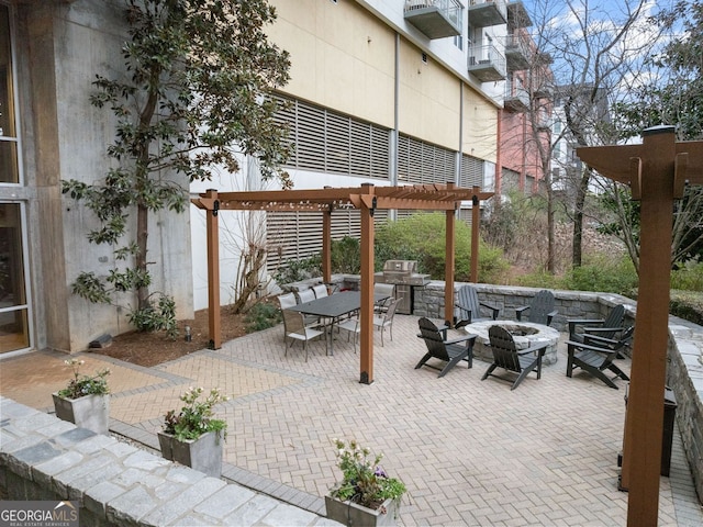 view of patio with outdoor dining space, area for grilling, an outdoor fire pit, and a pergola