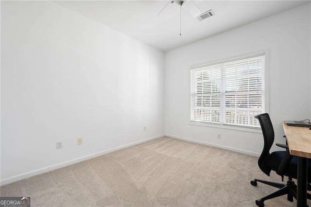 carpeted home office featuring baseboards and visible vents