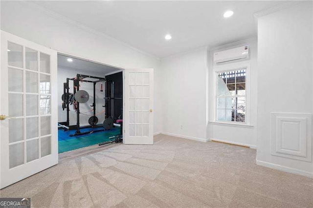 exercise room featuring carpet flooring, french doors, a wall mounted air conditioner, and crown molding