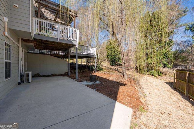 view of yard featuring a patio area, central AC, and a wooden deck