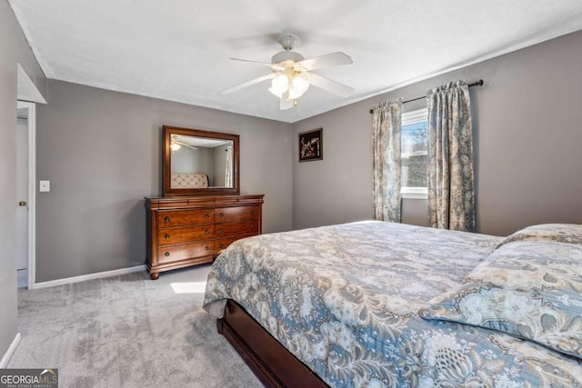 bedroom featuring baseboards, carpet floors, and ceiling fan