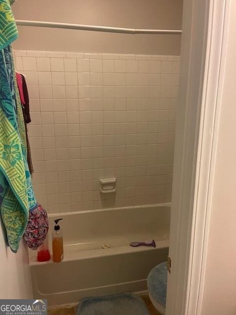 full bathroom with shower / bathtub combination with curtain