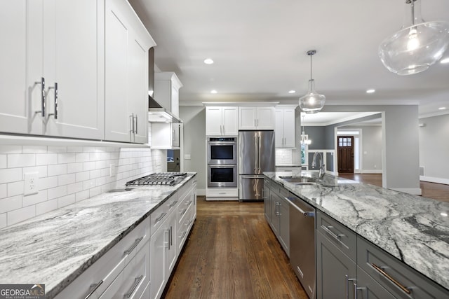 kitchen featuring white cabinetry, dark wood-type flooring, appliances with stainless steel finishes, and a sink