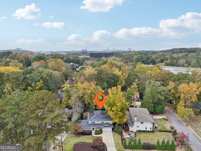 aerial view featuring a wooded view