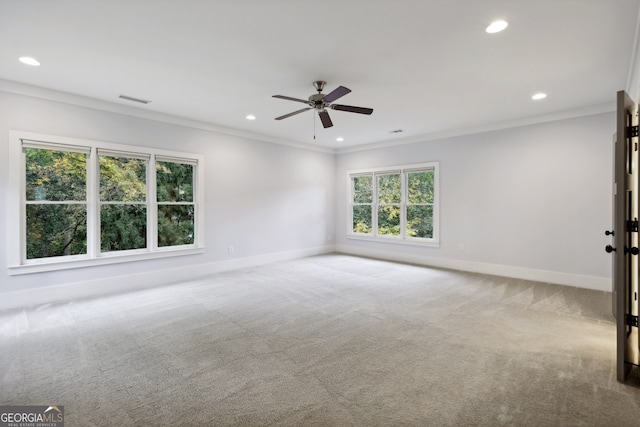 spare room with baseboards, recessed lighting, ceiling fan, ornamental molding, and carpet flooring