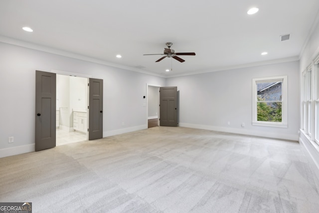 unfurnished bedroom featuring light carpet, recessed lighting, baseboards, and ornamental molding