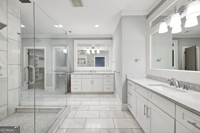 bathroom featuring visible vents, a stall shower, two vanities, and a sink