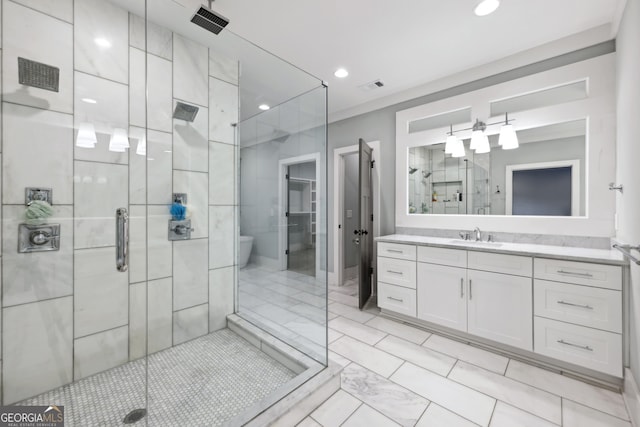 bathroom with vanity, visible vents, recessed lighting, a stall shower, and toilet