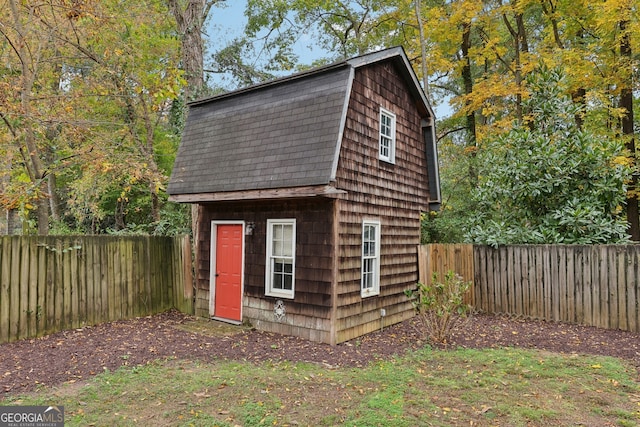 view of shed featuring a fenced backyard