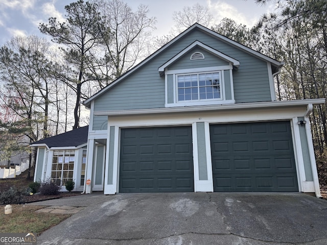 garage with concrete driveway