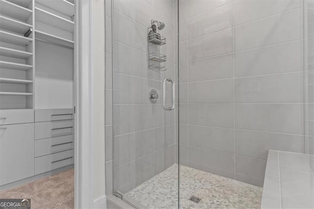 bathroom with tiled shower