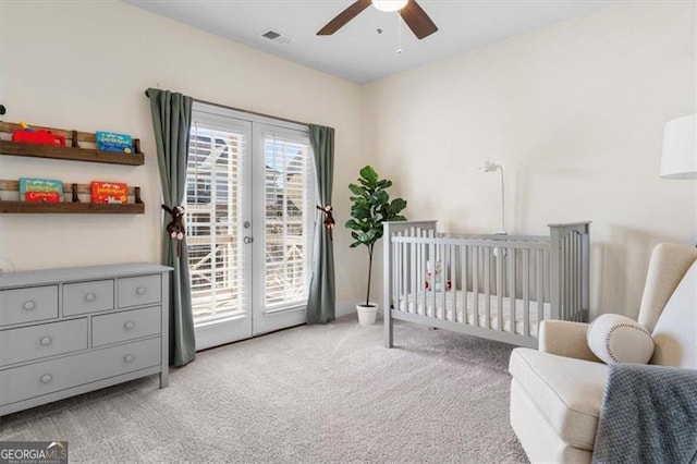 bedroom with access to exterior, multiple windows, light colored carpet, and french doors