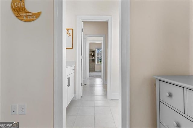 hallway with light tile patterned floors