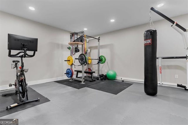 exercise room featuring recessed lighting and baseboards