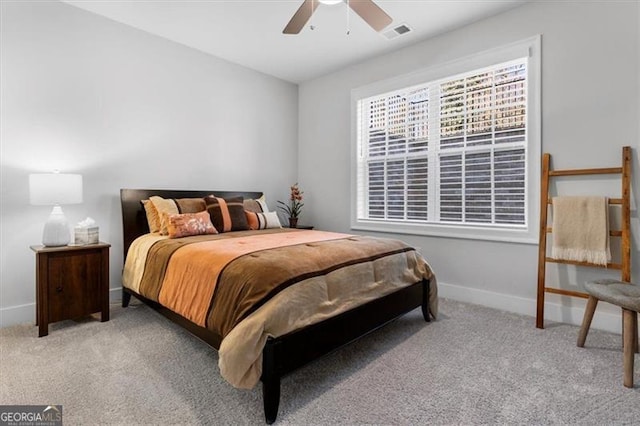 bedroom with a ceiling fan, carpet, visible vents, and baseboards