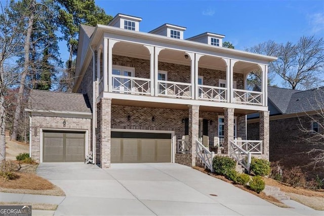 view of front of house with brick siding, a porch, a balcony, and driveway