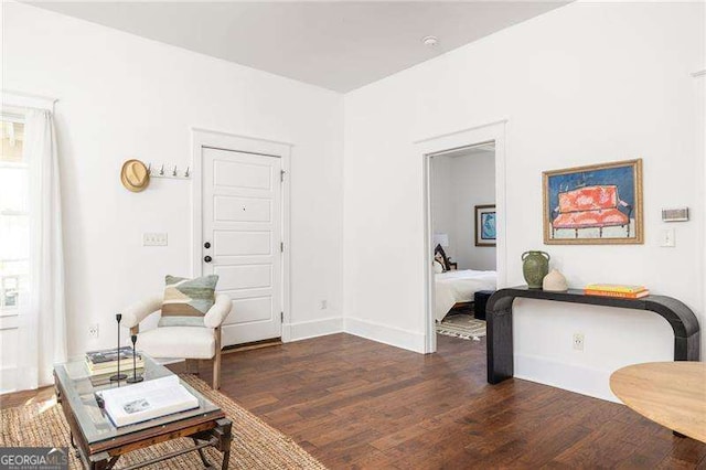 interior space featuring dark wood-style floors and baseboards