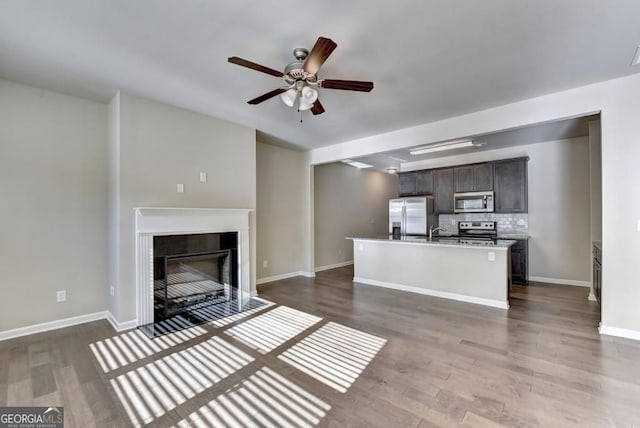 3082 Cedar Glade Ln NE, Buford, GA 30519 - kitchen featuring appliances with stainless steel finishes, a ceiling fan, an island with sink, and wood finished floors