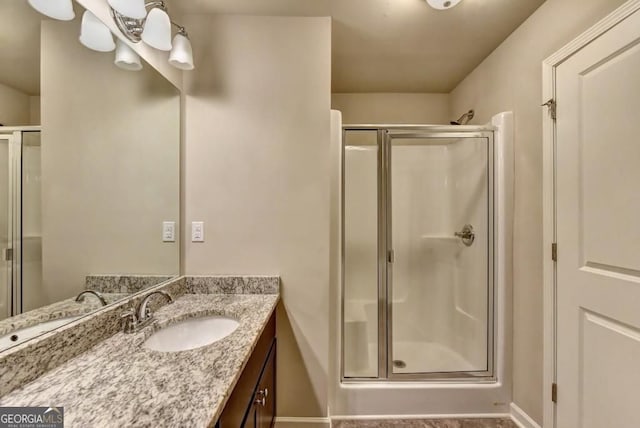 3082 Cedar Glade Ln NE, Buford, GA 30519 - bathroom featuring a shower stall, vanity, and baseboards