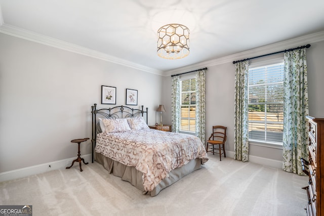 carpeted bedroom featuring a notable chandelier, multiple windows, baseboards, and ornamental molding