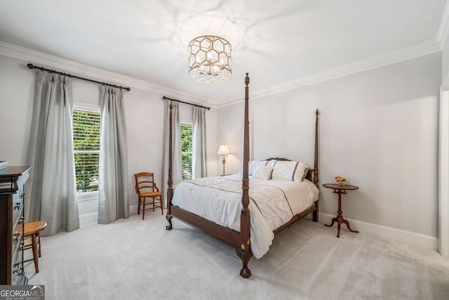 carpeted bedroom featuring a notable chandelier, ornamental molding, and baseboards