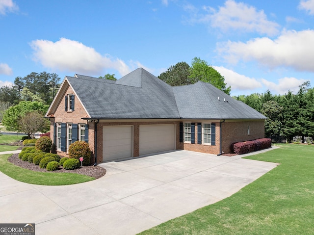 single story home with concrete driveway, a front lawn, an attached garage, brick siding, and a shingled roof