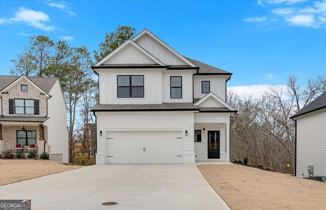 modern inspired farmhouse with board and batten siding, concrete driveway, an attached garage, and a shingled roof