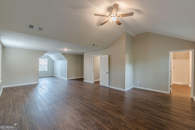 bonus room with dark wood-style flooring, ceiling fan, a textured ceiling, and vaulted ceiling