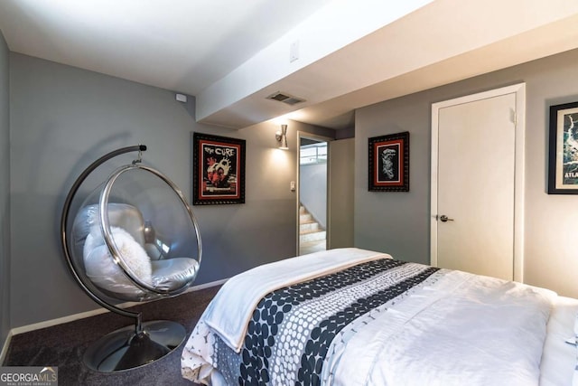 bedroom with carpet and baseboards