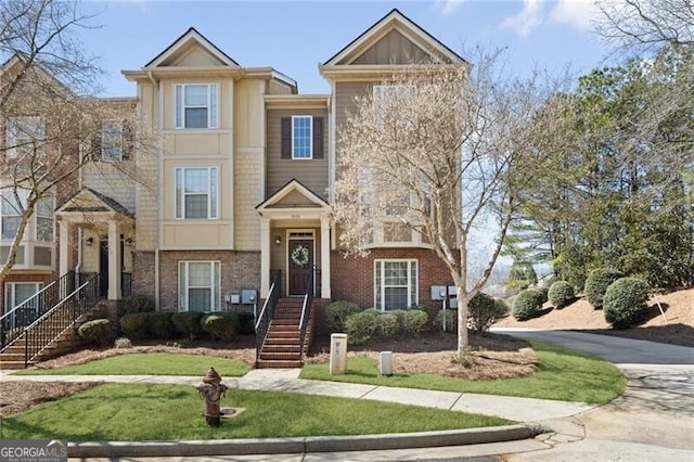 townhome / multi-family property featuring brick siding