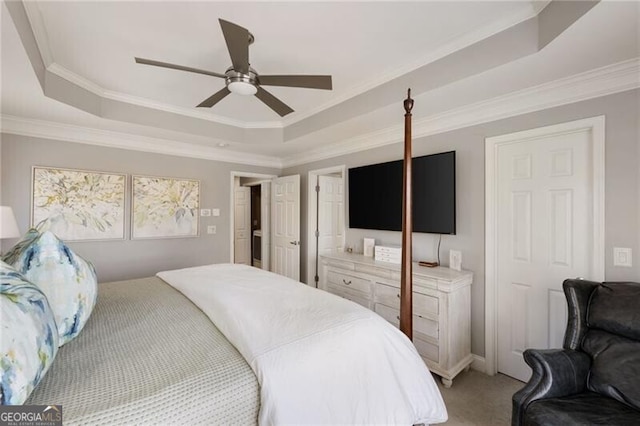 bedroom with light colored carpet, crown molding, and a raised ceiling