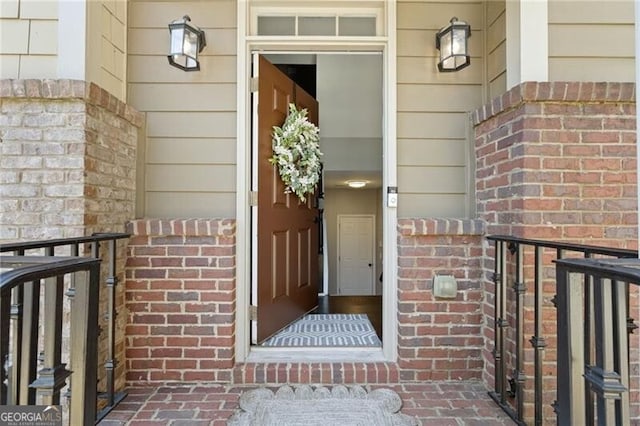 entrance to property with brick siding