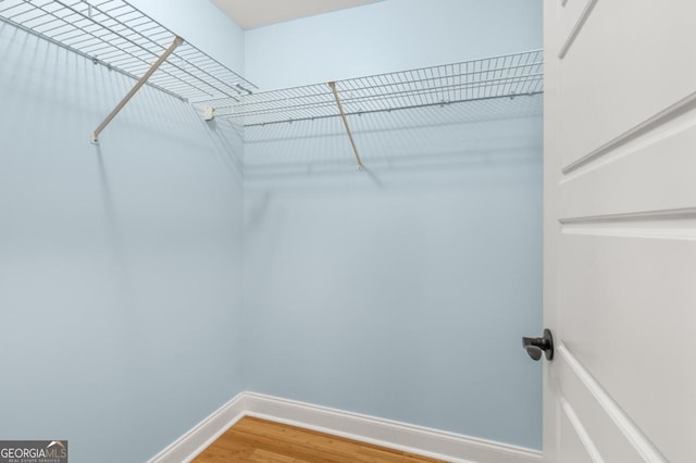 spacious closet with light wood-type flooring