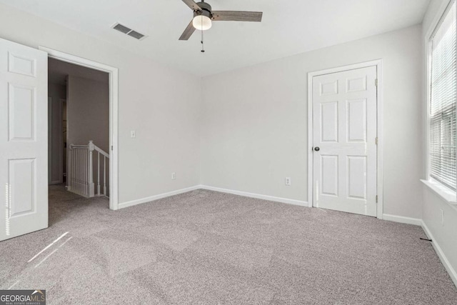 unfurnished bedroom with visible vents, ceiling fan, baseboards, and carpet floors